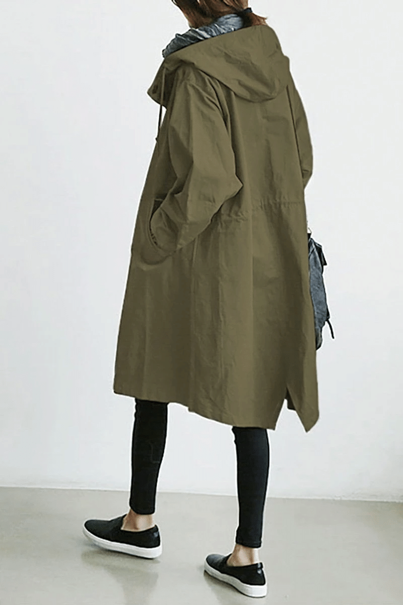 Olive green longline hooded windbreaker with a relaxed oversized fit, drawstring hood, and side pockets.