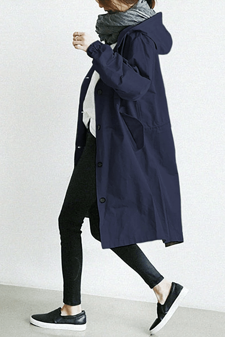 Navy blue longline hooded windbreaker with button-front closure, elasticated cuffs, and side pockets.