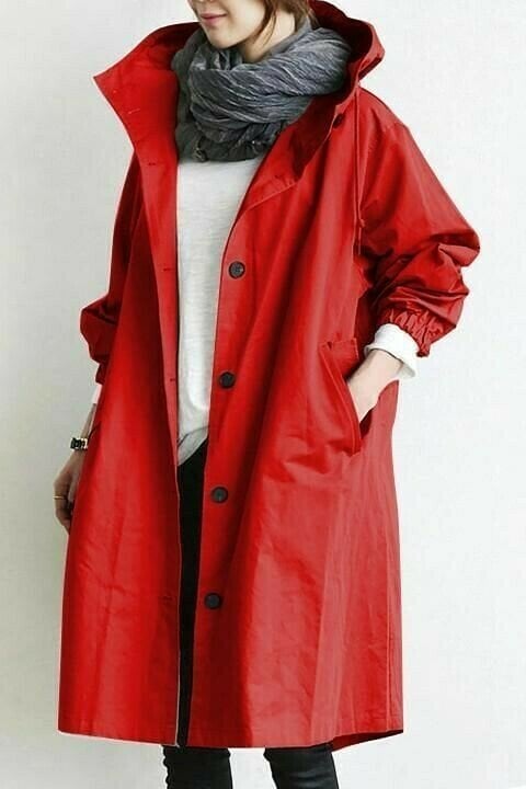 Red longline hooded windbreaker with button front, elasticated cuffs, and side pockets in an oversized fit.