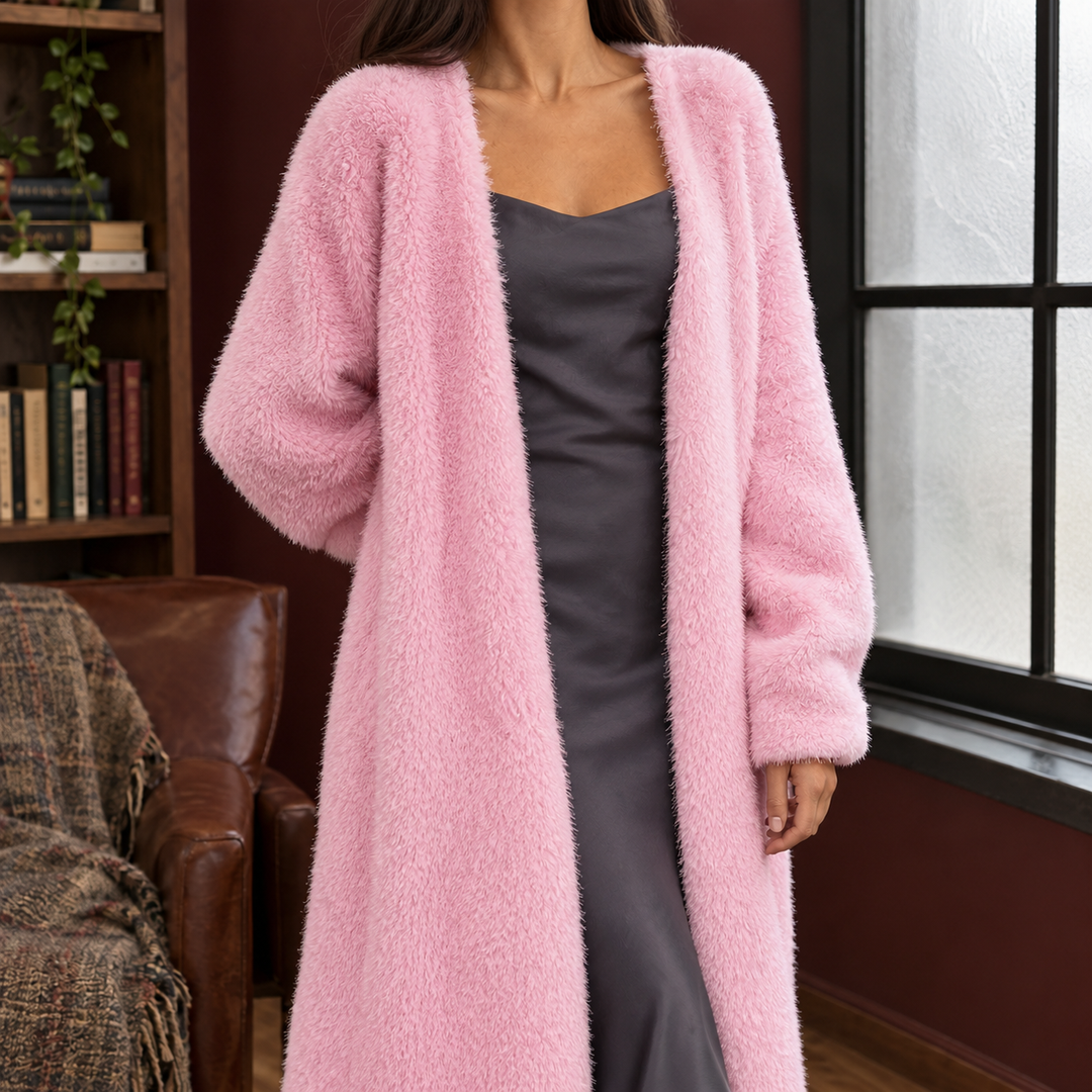 Women wearing a soft, pink plush knit longline cardigan with an open front and relaxed, voluminous sleeves.