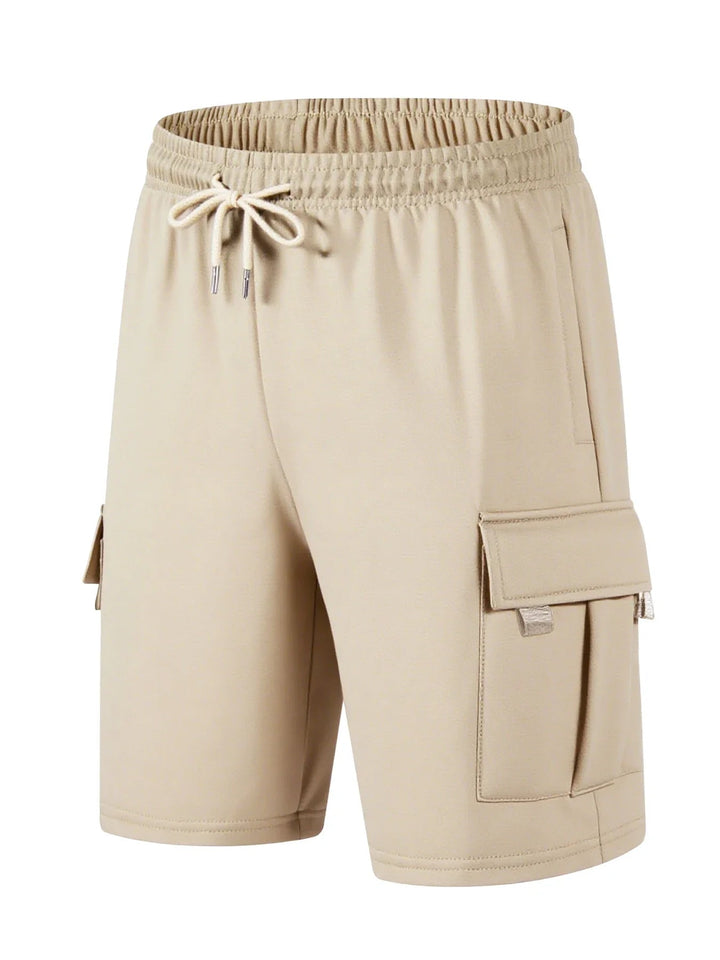 Beige men's knee-length cargo shorts with an elastic drawstring waist and side flap pockets.