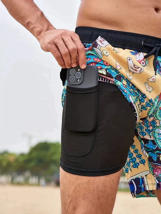 George men's swim shorts with a colorful print, drawstring waist, and black inner liner featuring a side phone pocket.