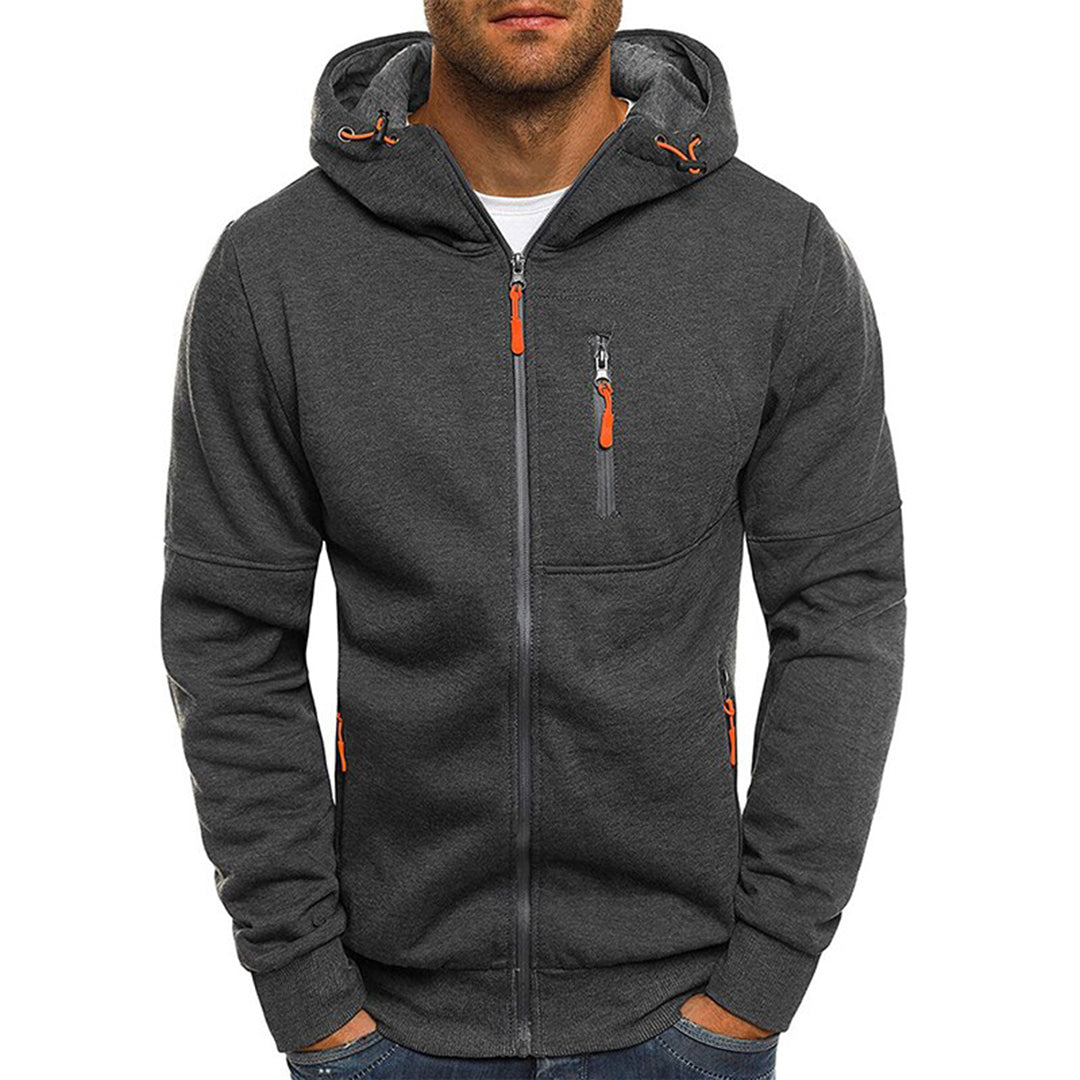 Men's charcoal grey zip-up hooded jacket with contrast orange zipper pulls, drawcord hood, and chest pocket.