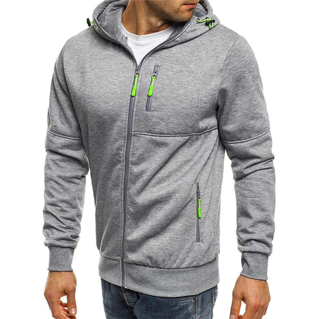 Grey zip-up hooded jacket with neon green accents, drawcord hood, and multiple zippered pockets.