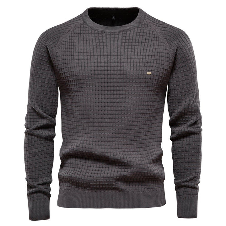 Charcoal grey men's crew neck jumper with a waffle-textured knit, raglan sleeves, and ribbed trims.