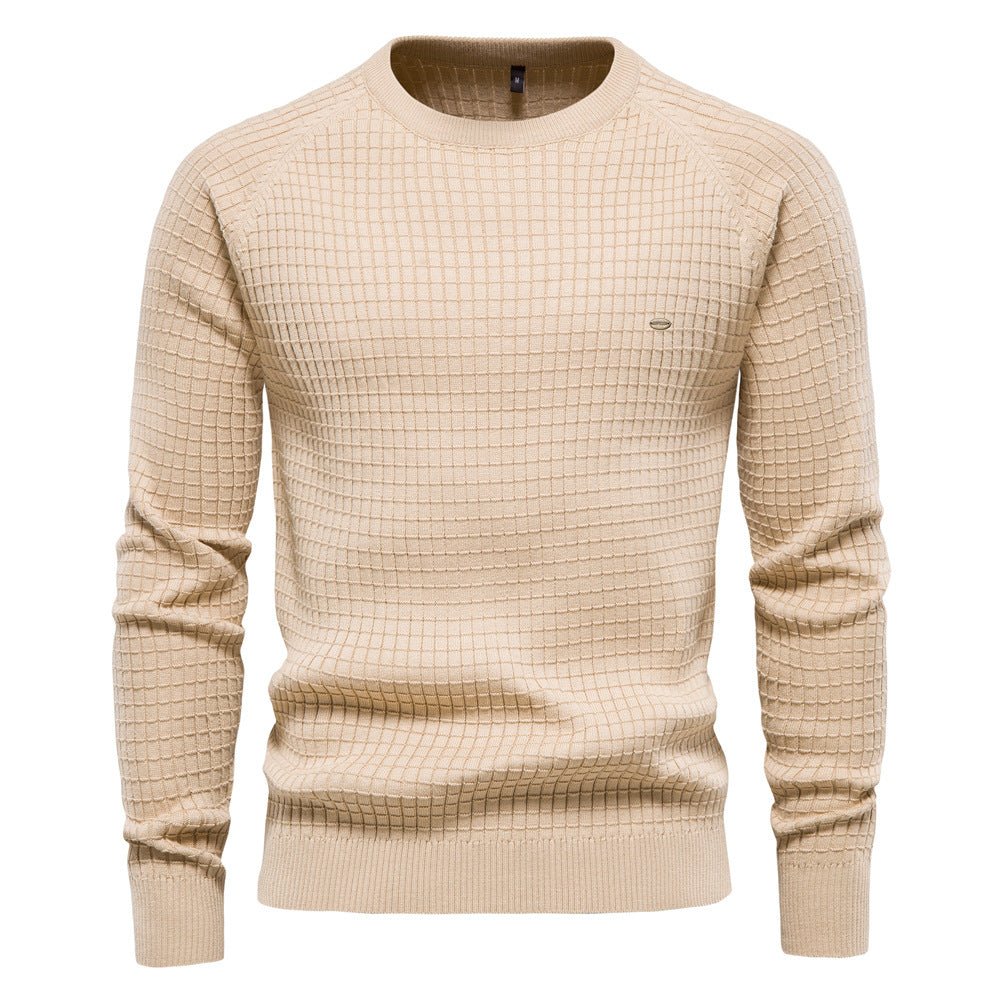 Beige men's crew neck jumper in a waffle-textured knit with raglan sleeves and ribbed cuffs, hem, and neckline.
