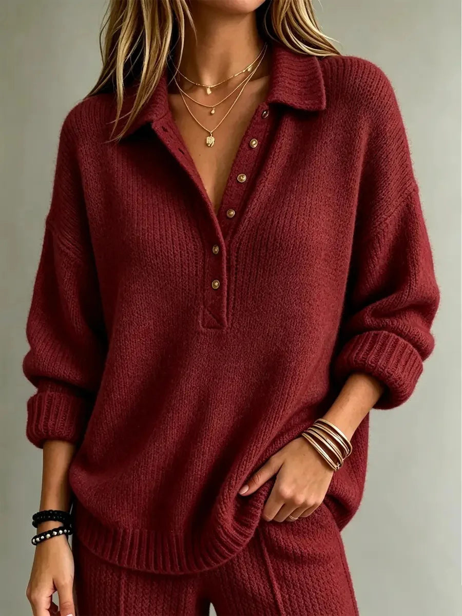 Burgundy button-neck polo jumper in a soft, textured knit with a relaxed fit, dropped shoulders, and ribbed cuffs.