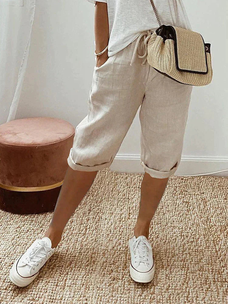 Effortless Georgia linen drawstring shorts in a relaxed natural hue, featuring a clean hem and side pockets.
