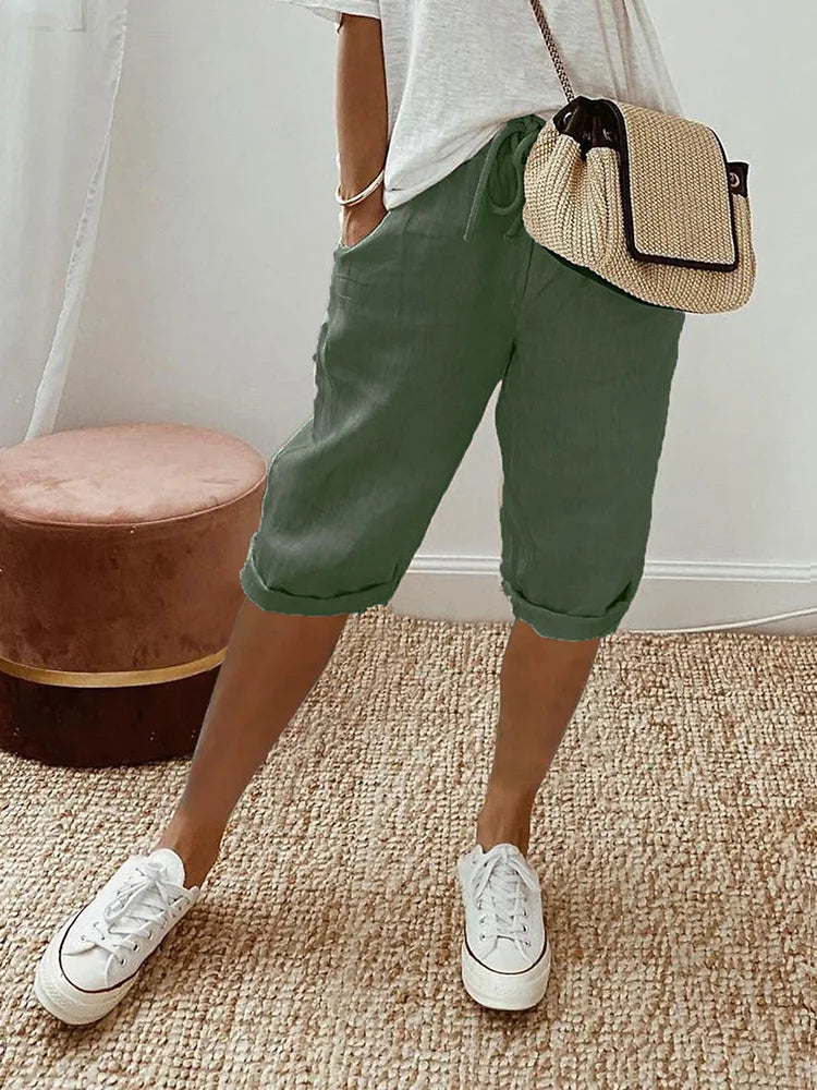 Women's Georgia linen drawstring shorts in olive green, featuring side pockets and a cuffed hem.