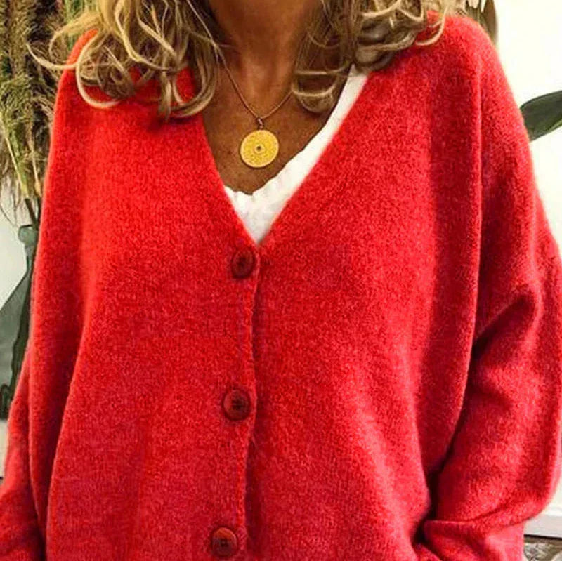 Bright red soft knit V-neck cardigan with a button-down front and relaxed, comfortable fit.