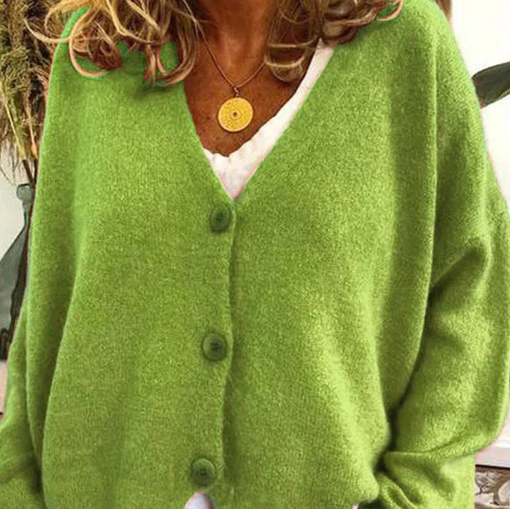 Soft lime green V-neck cardigan in a relaxed knit fabric with a classic three-button front closure.