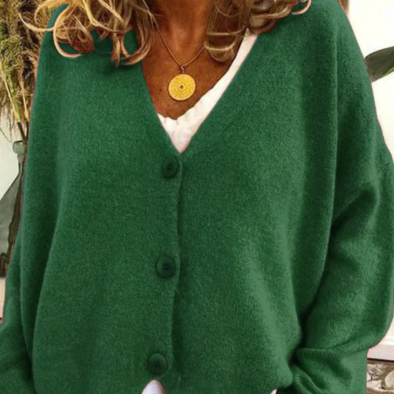 Soft forest green knit cardigan with a V-neckline and matching front buttons in a relaxed, comfortable fit.