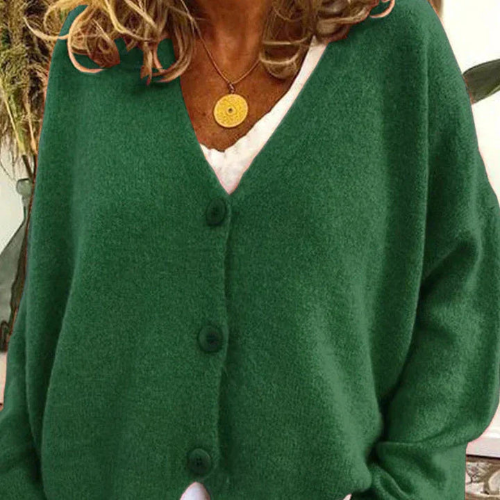 Soft forest green knit cardigan with a V-neckline and matching front buttons in a relaxed, comfortable fit.
