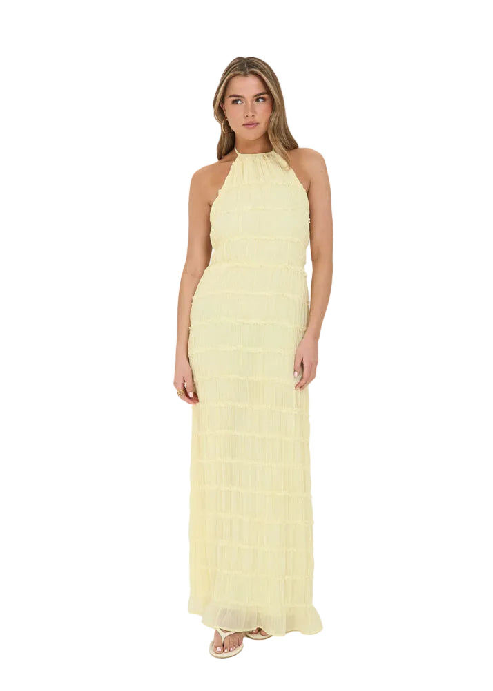 Cream-colored halter maxi dress in textured, tiered fabric with a slim, body-skimming fit and ankle-length hem.