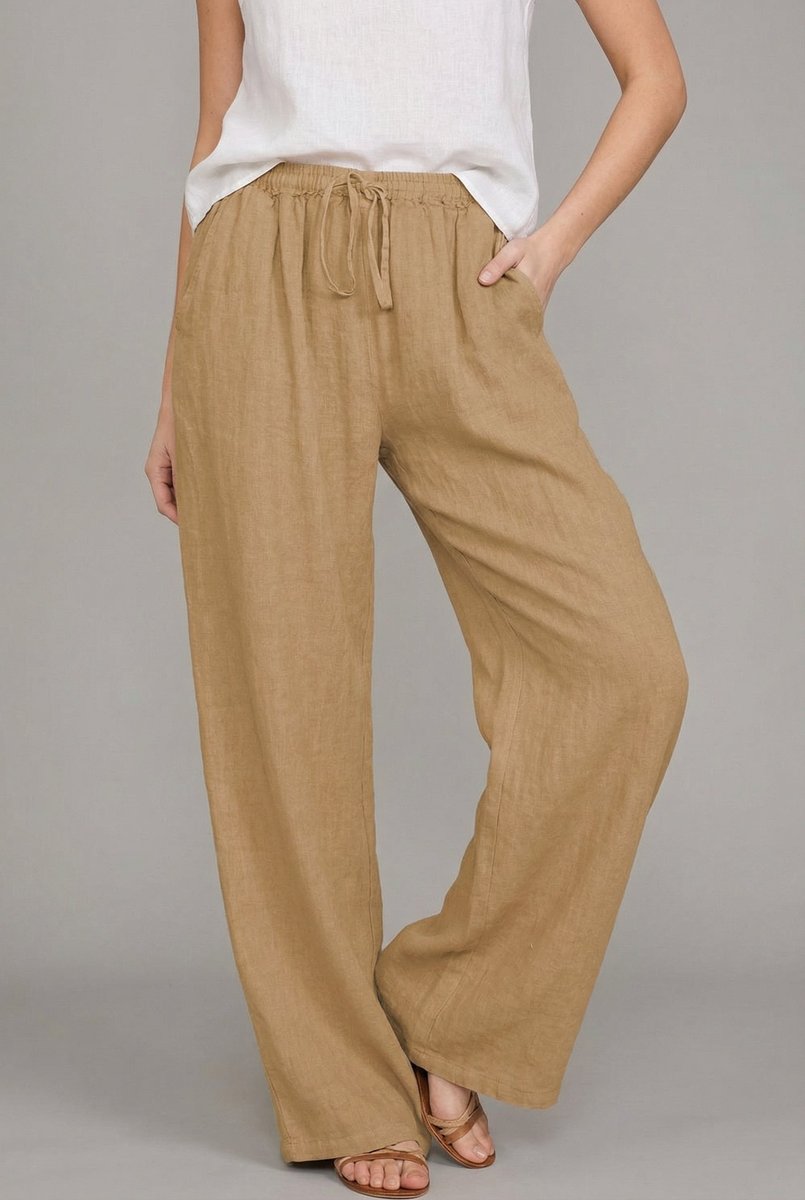 Tan wide-leg linen trousers featuring an elasticated drawstring waist and side pockets on a model.