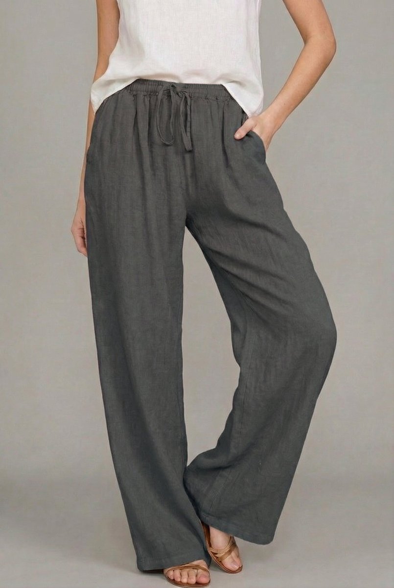 Charcoal grey wide-leg linen trousers featuring an elasticated drawstring waist and side pockets.