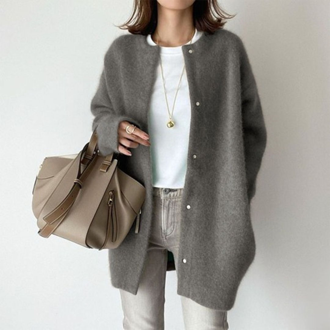 Charcoal grey oversized longline cardigan in soft brushed knit with a round collarless neckline and front button closure.