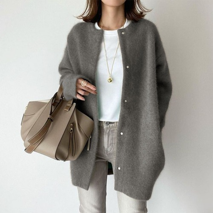 Charcoal grey oversized longline cardigan in soft brushed knit with a round collarless neckline and front button closure.