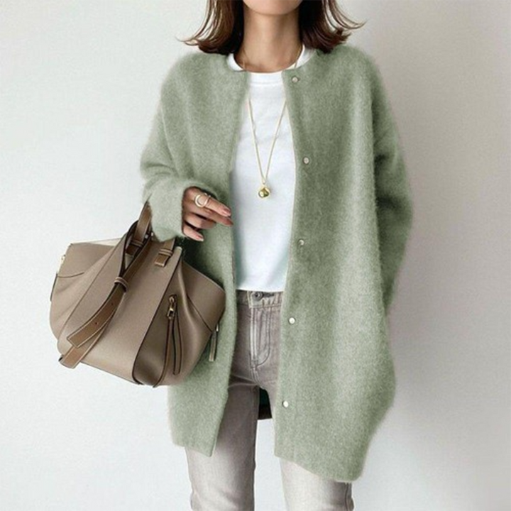 Sage green oversized longline cardigan in soft brushed knit with a round collarless neckline and button-front closure.