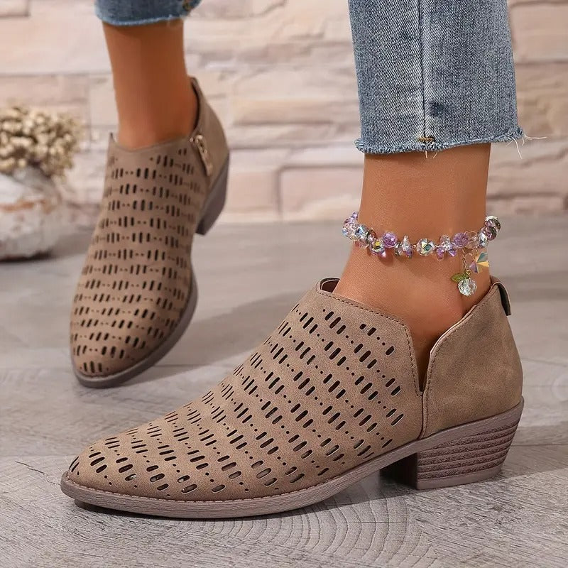 Taupe Harriet ankle boots with a modern cut-out design, pointed toe, and comfortable low block heel for effortless spring style.