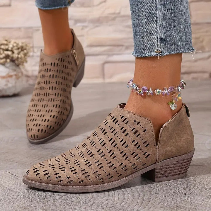 Taupe Harriet ankle boots with a modern cut-out design, pointed toe, and comfortable low block heel for effortless spring style.