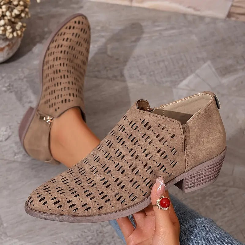 Taupe Harriet ankle boots featuring a breathable laser-cut design, pointed toe, and comfortable low block heel for easy styling.