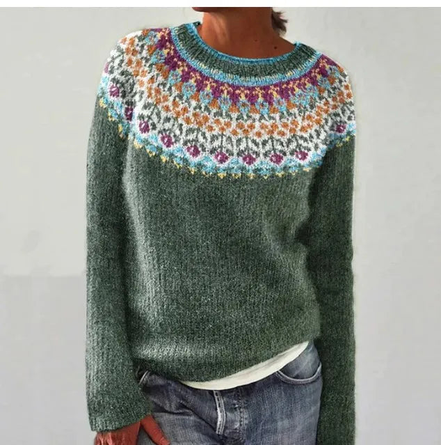 Women's green Nordic knit jumper featuring a vibrant, multi-coloured patterned yoke and a relaxed boat neckline.