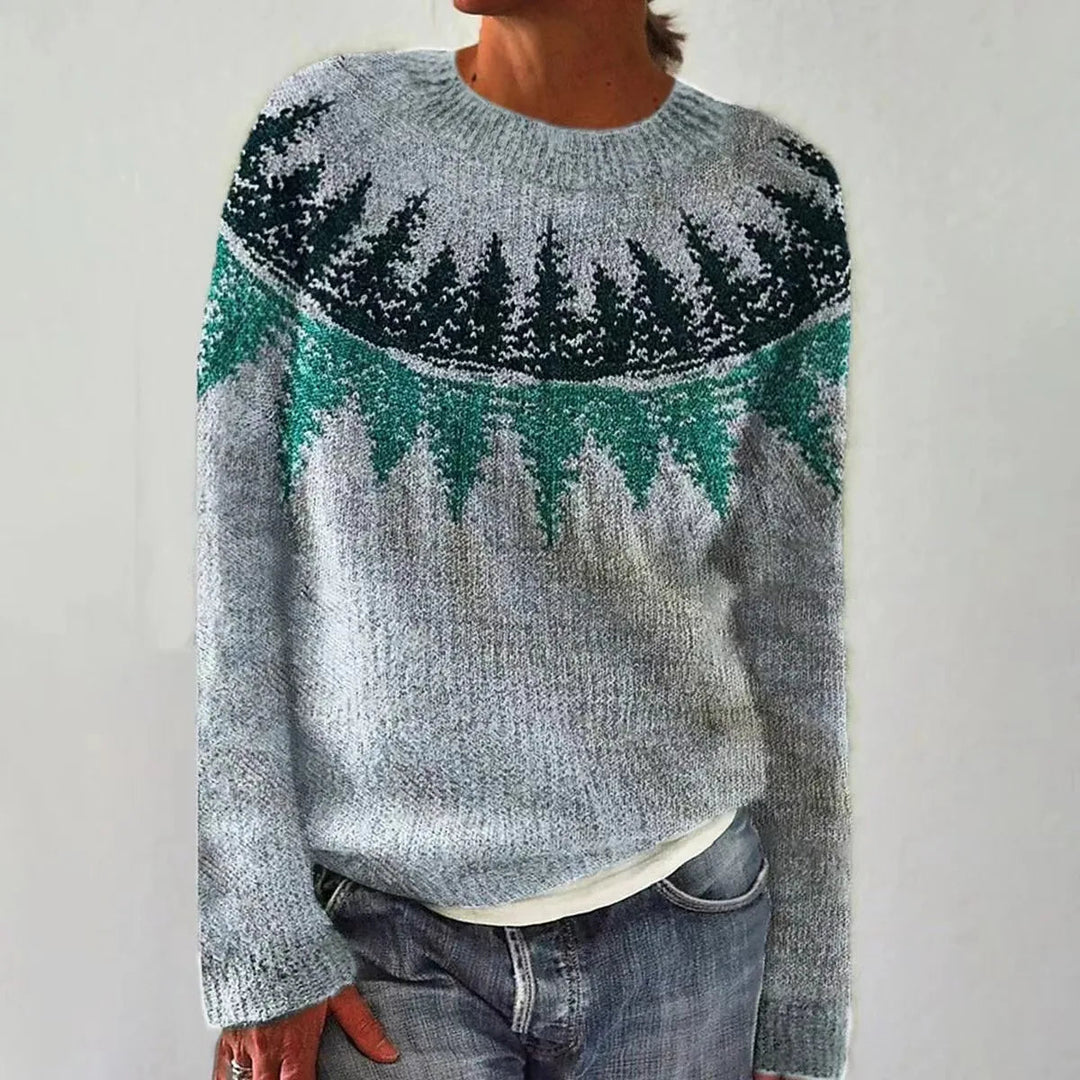 Grey Nordic knit jumper featuring a green and dark forest-inspired patterned yoke and a relaxed boat neckline.