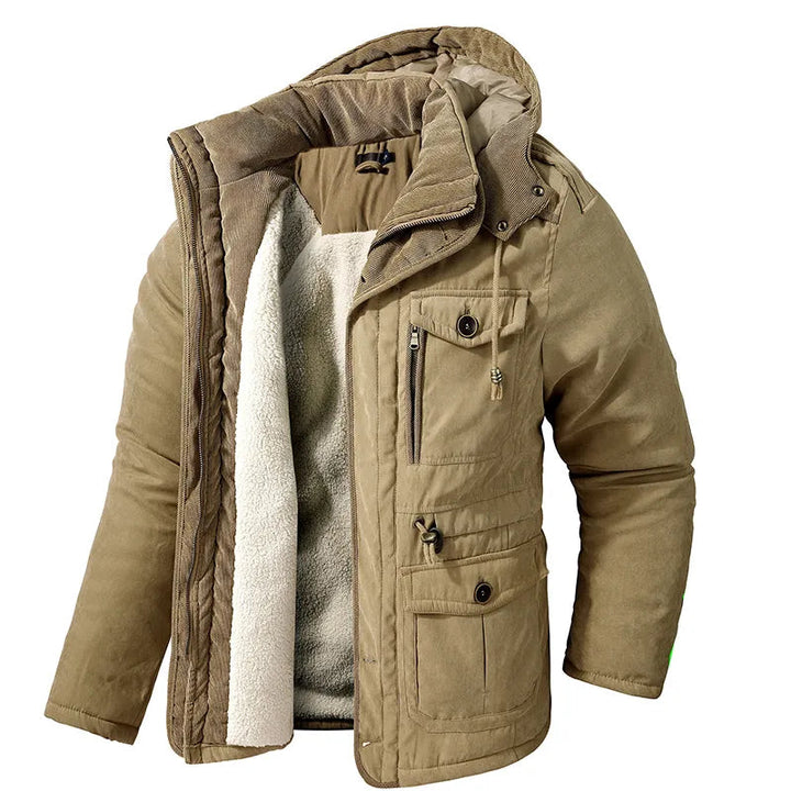 Tan men's winter parka with a plush white fleece lining, detachable hood, and multiple utility pockets with button closures.