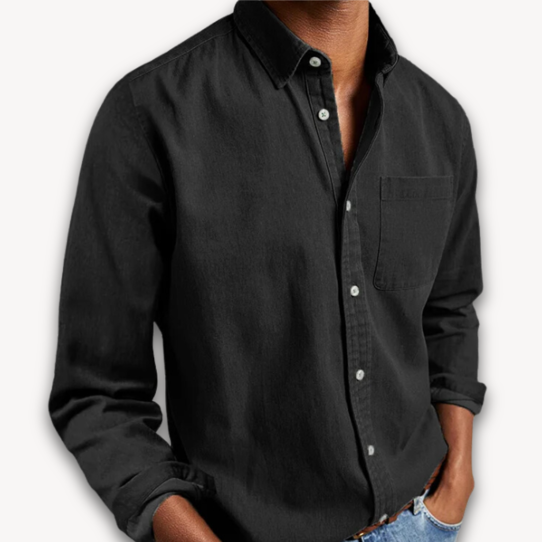 Men's black long-sleeve button-up shirt with a classic collar, chest pocket, and relaxed fit.