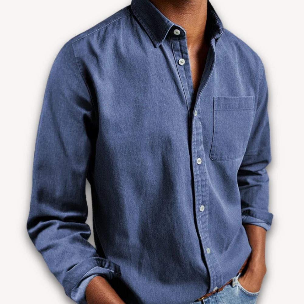 Men's blue long-sleeve button-up shirt with a classic collar and a single chest pocket, worn in a relaxed style.
