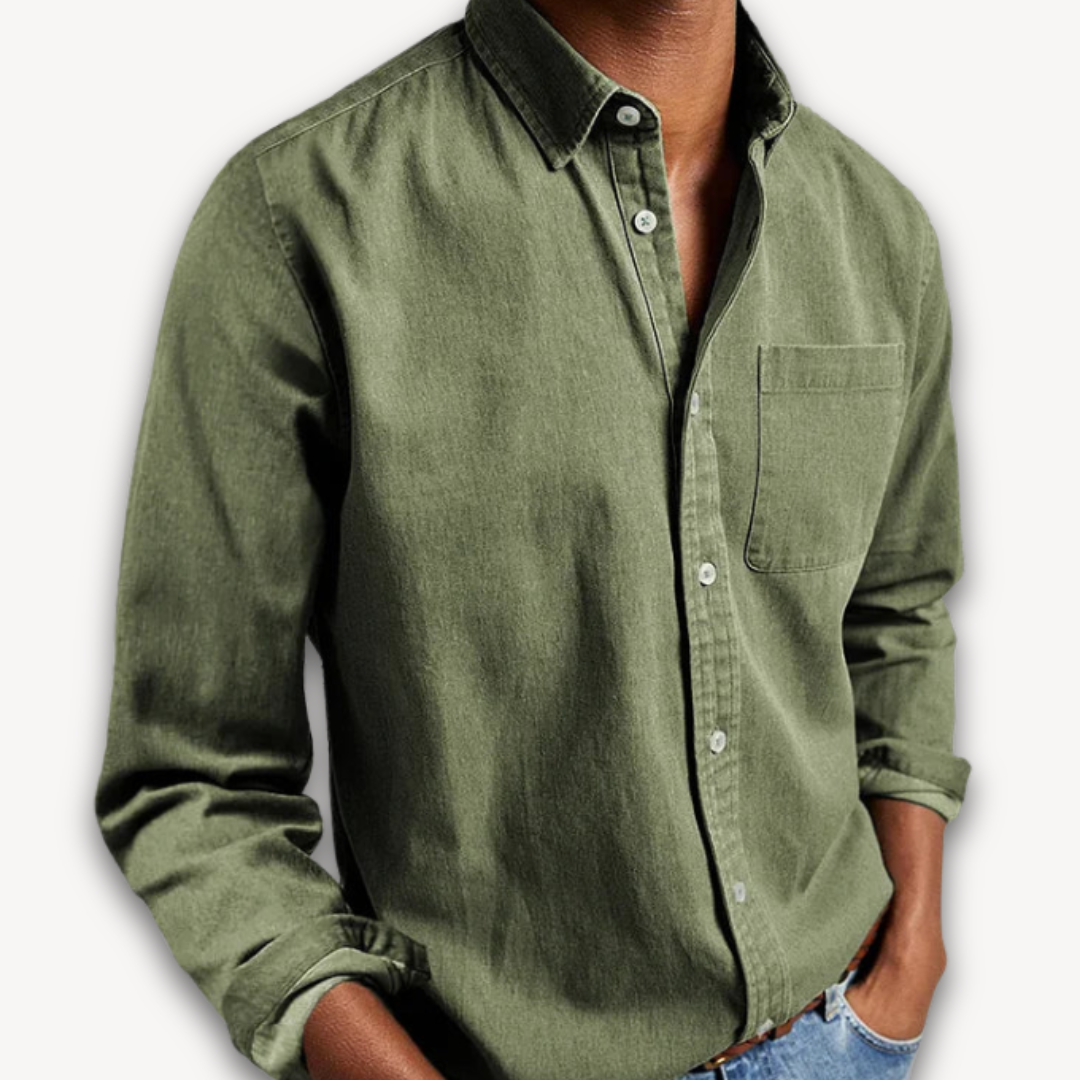 Olive green long-sleeve button-up shirt with a classic collar and single chest pocket, worn with jeans.