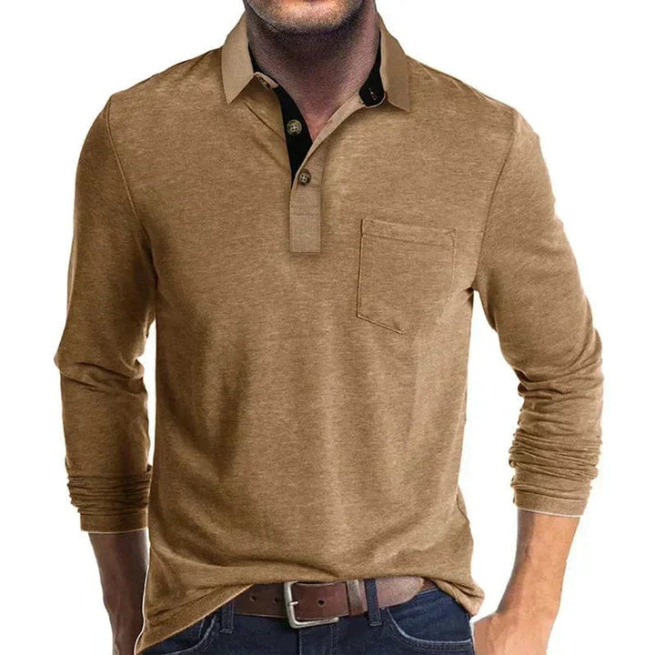 Tan long-sleeve polo shirt with a contrast black inner collar, two-button placket, and a functional chest pocket.