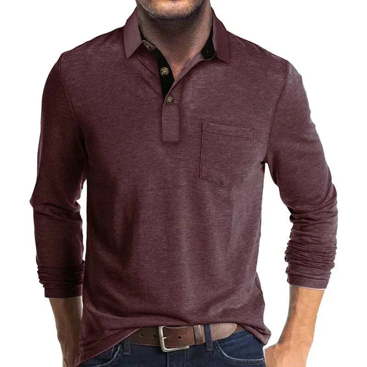 Burgundy long-sleeve polo shirt with a contrast black collar, two-button placket, and a functional chest pocket.