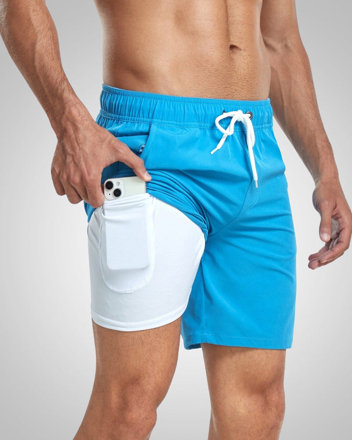Blue Henry swim shorts with a white drawstring waist and integrated white inner liner featuring a side phone pocket.