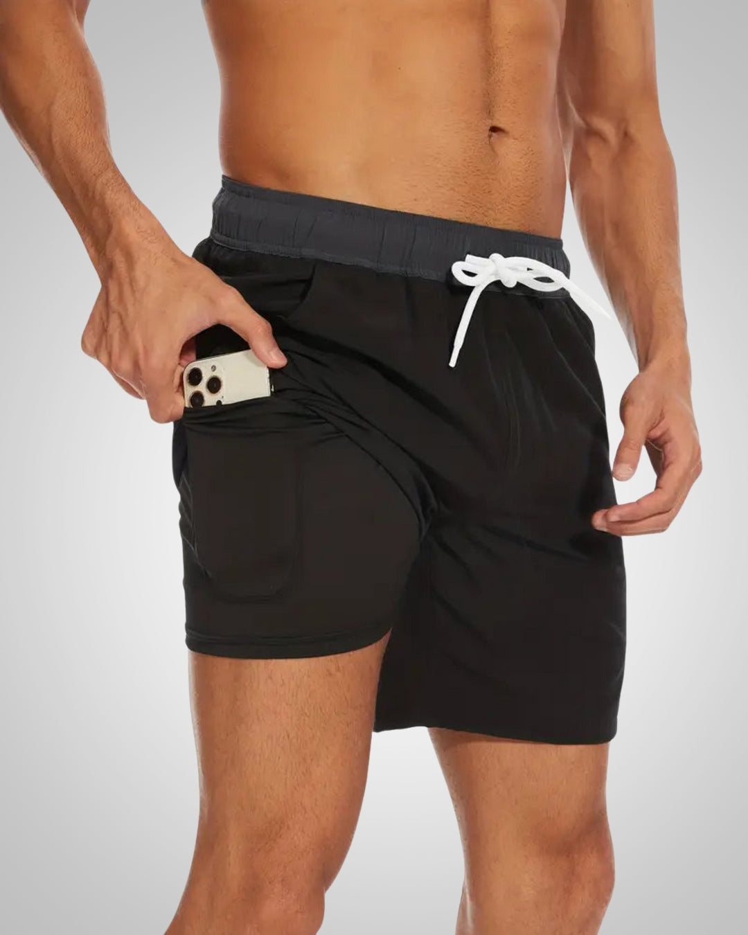 Black men's lined swim shorts with an elastic drawstring waist and a hidden side phone pocket on the inner layer.