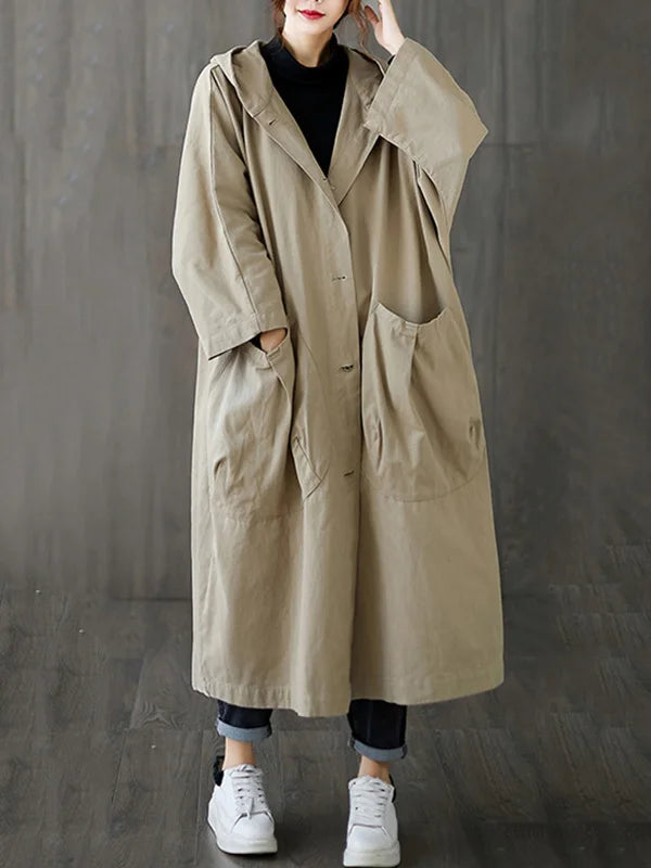 Relaxed, beige longline hooded coat with oversized fit, button front, and large patch pockets.