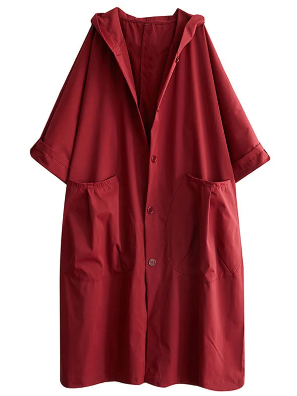 Deep red longline hooded coat with a relaxed oversized fit, button front, and large front patch pockets.