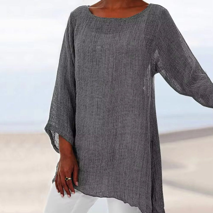 Charcoal grey oversized linen tunic with long sleeves, a round neckline, and a relaxed, breezy longline fit.