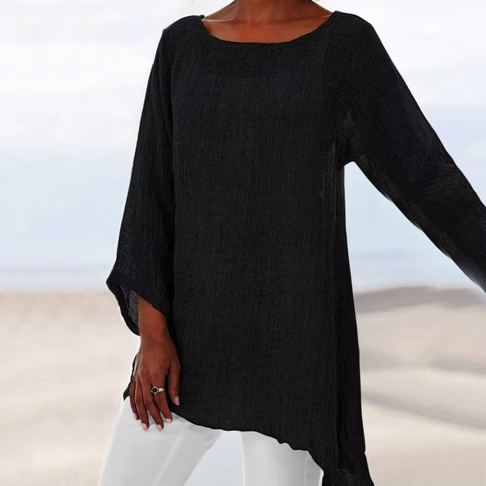 Black oversized linen tunic top with a round neckline, long sleeves, and a relaxed, breezy longline fit.