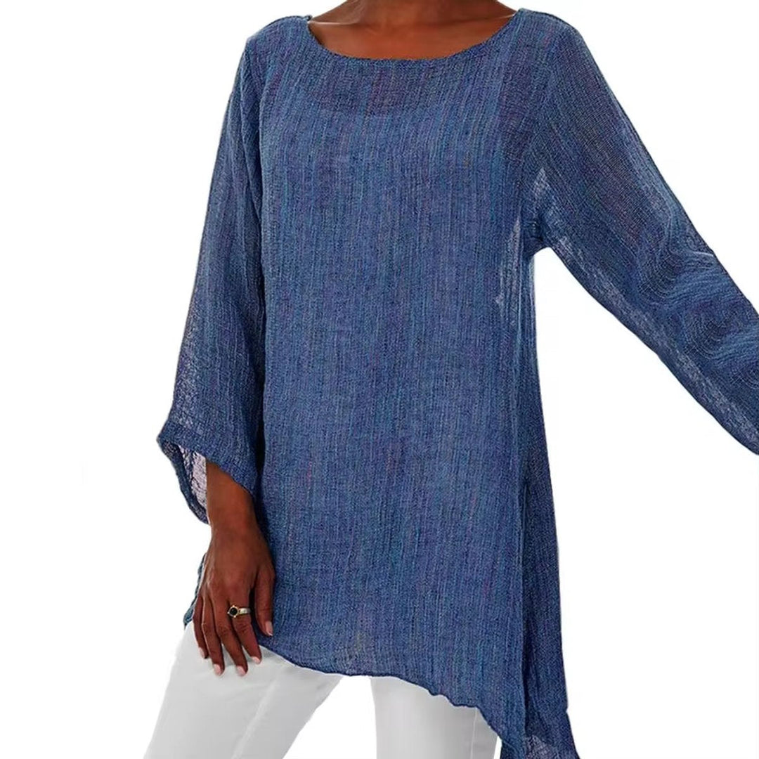 Blue oversized linen tunic with a round neckline, long sleeves, and a relaxed, breezy longline hem.