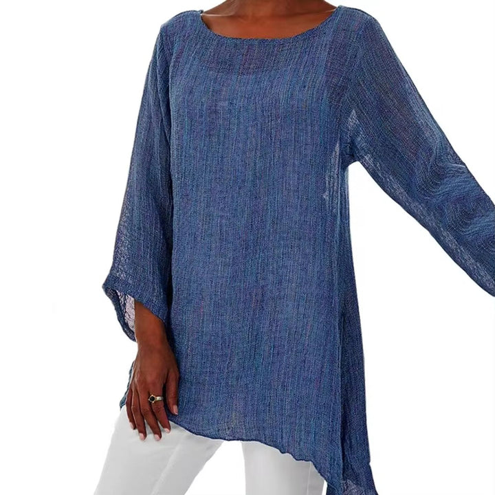 Blue oversized linen tunic with a round neckline, long sleeves, and a relaxed, breezy longline hem.