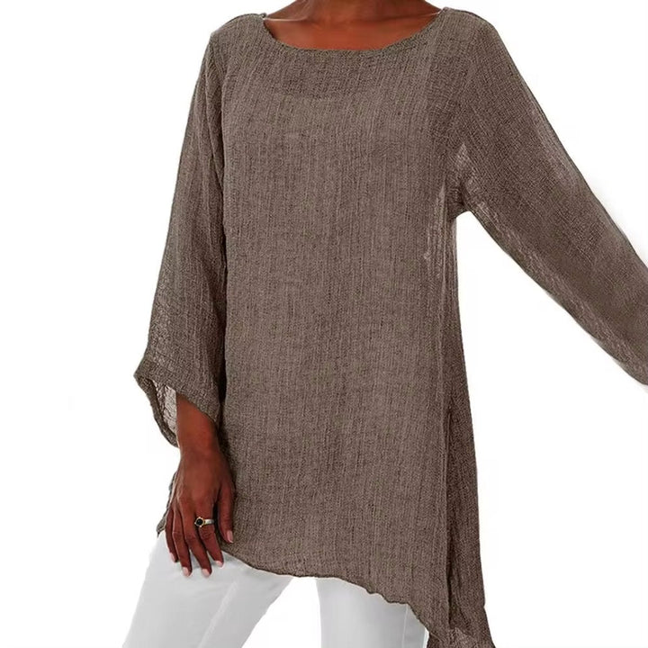 Brown oversized linen tunic top with a round neckline, long sleeves, and a breezy, longline hem.