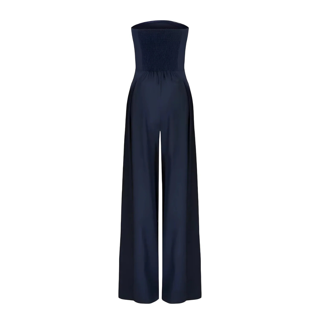 Women's navy strapless wide-leg Imogen jumpsuit with a shirred bodice and pleated front detail.
