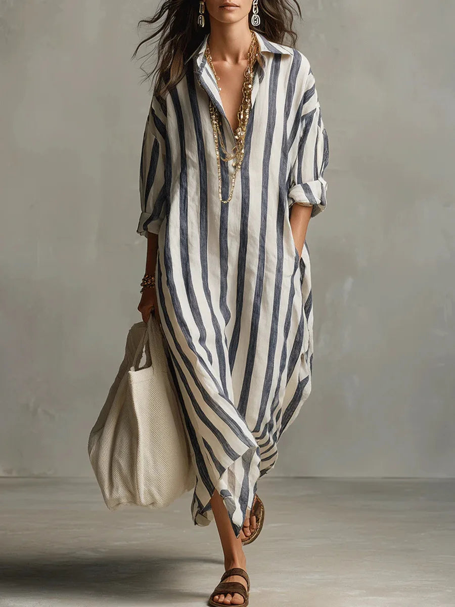 Woman wearing a relaxed, vertical-striped linen maxi shirt dress with a collar and button placket.