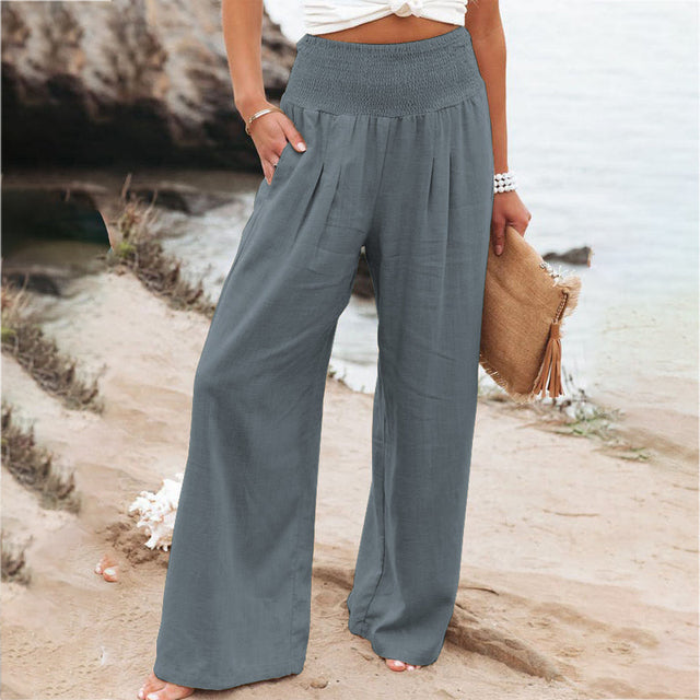 Iris women's relaxed fit grey linen summer trousers with elastic waistband and pockets, perfect for comfort and polish.
