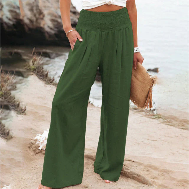Women's Iris olive green linen summer trousers with a relaxed fit, elastic waistband, and side pockets.