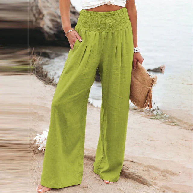 Women's Iris lime green linen summer trousers with a relaxed fit, elastic waistband, and side pockets.