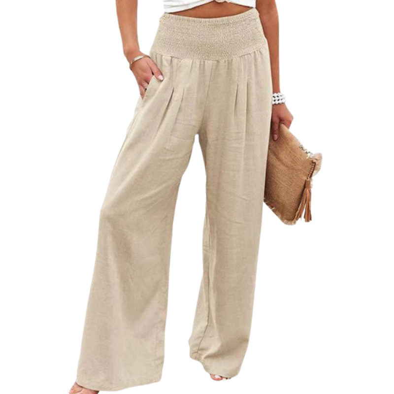 Iris Women's Linen Summer Trousers: relaxed fit, flowing beige linen pants with a shirred elastic waistband and pockets.