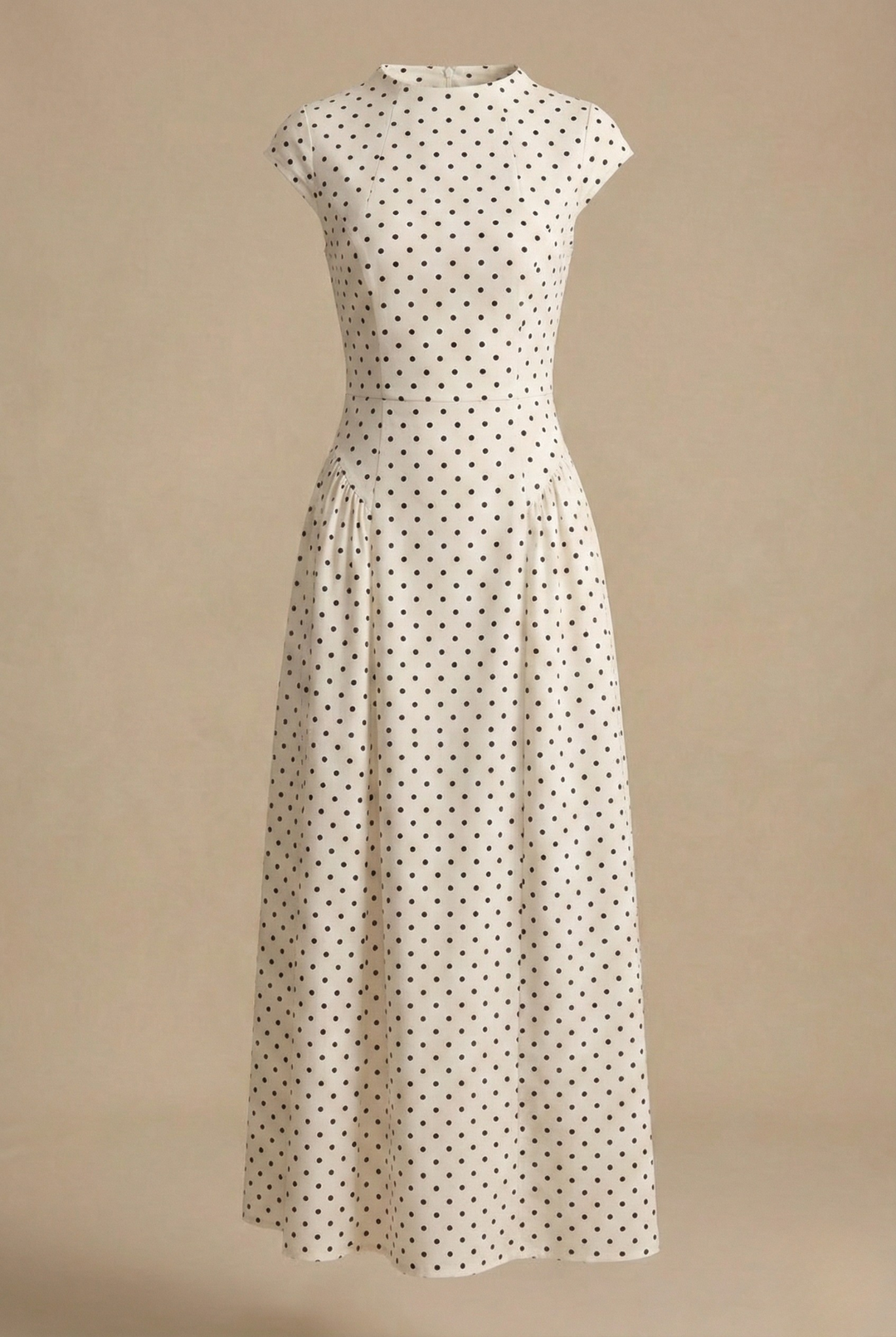 Isabelle women's white polka dot A-line maxi dress with a round neckline and defined waist.